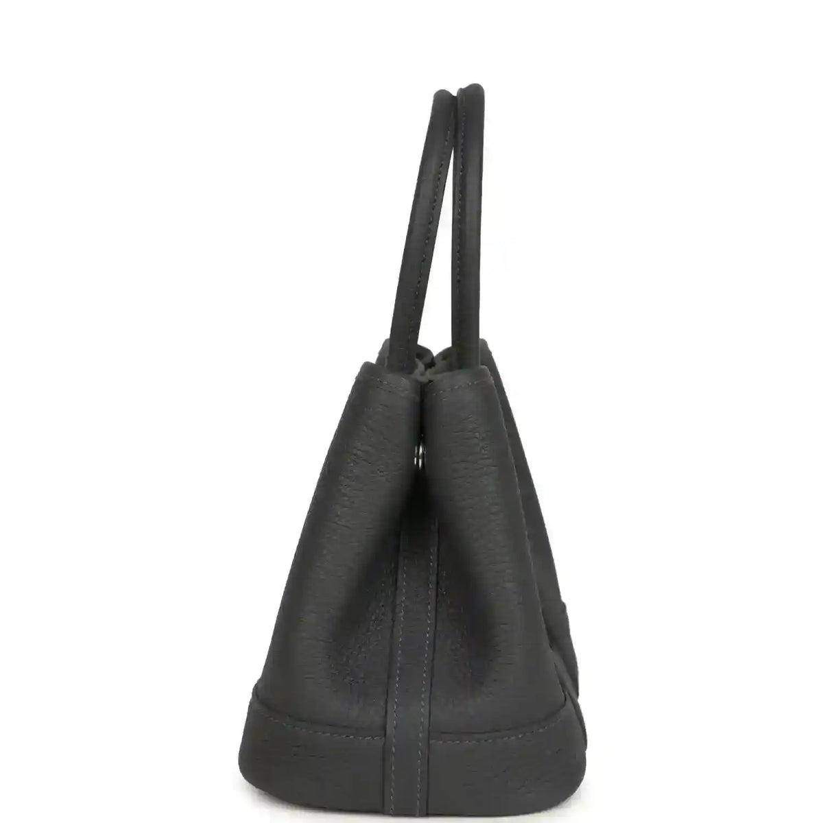 Dark gray leather tote bag viewed from the side with double top handles