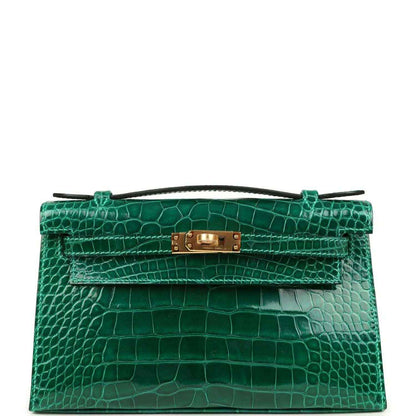Hermes Kelly pochette bag in shiny green alligator leather with gold front clasp