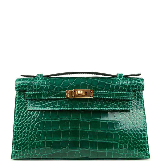Hermes Kelly pochette bag in shiny green alligator leather with gold front clasp