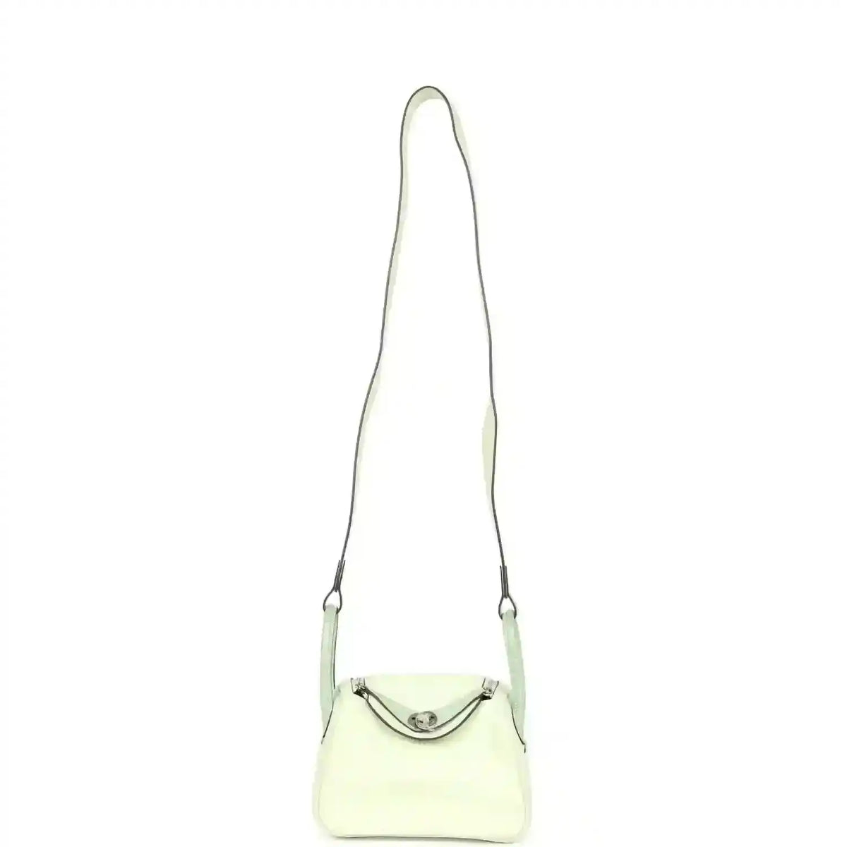 Mini Lindy mini bag on long strap, pale green leather with curved front clasp