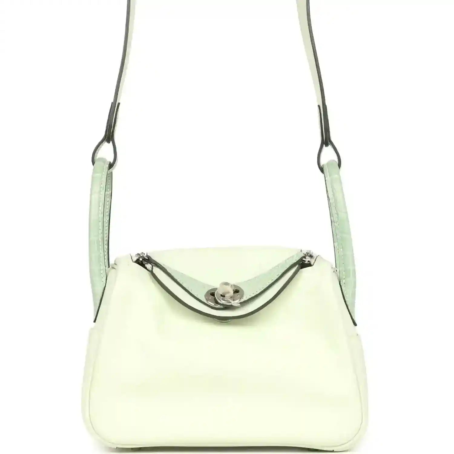 Mini Lindy crossbody bag in pale green and light cream leather, curved front flap