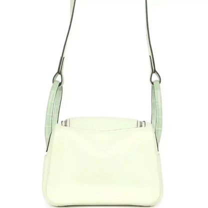 Mini Lindy crossbody bag in light pale green leather with top opening and side seams