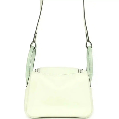 Mini Lindy crossbody bag in light pale green leather with top opening and side seams