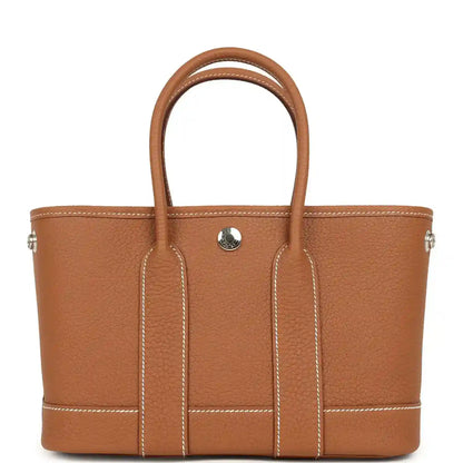 Hermes Garden Party Neo 23 tote bag in gold-toned leather, two handles, front pocket tab