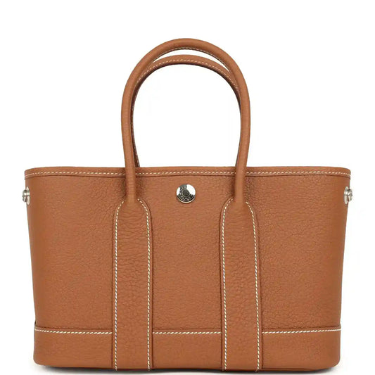 Hermes Garden Party Neo 23 tote bag in gold-toned leather, two handles, front pocket tab