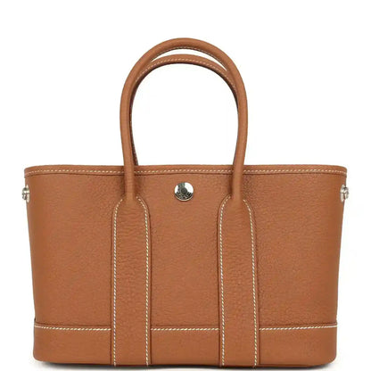 Hermes Garden Party Neo 23 tote bag in gold-toned leather, two handles, front pocket tab