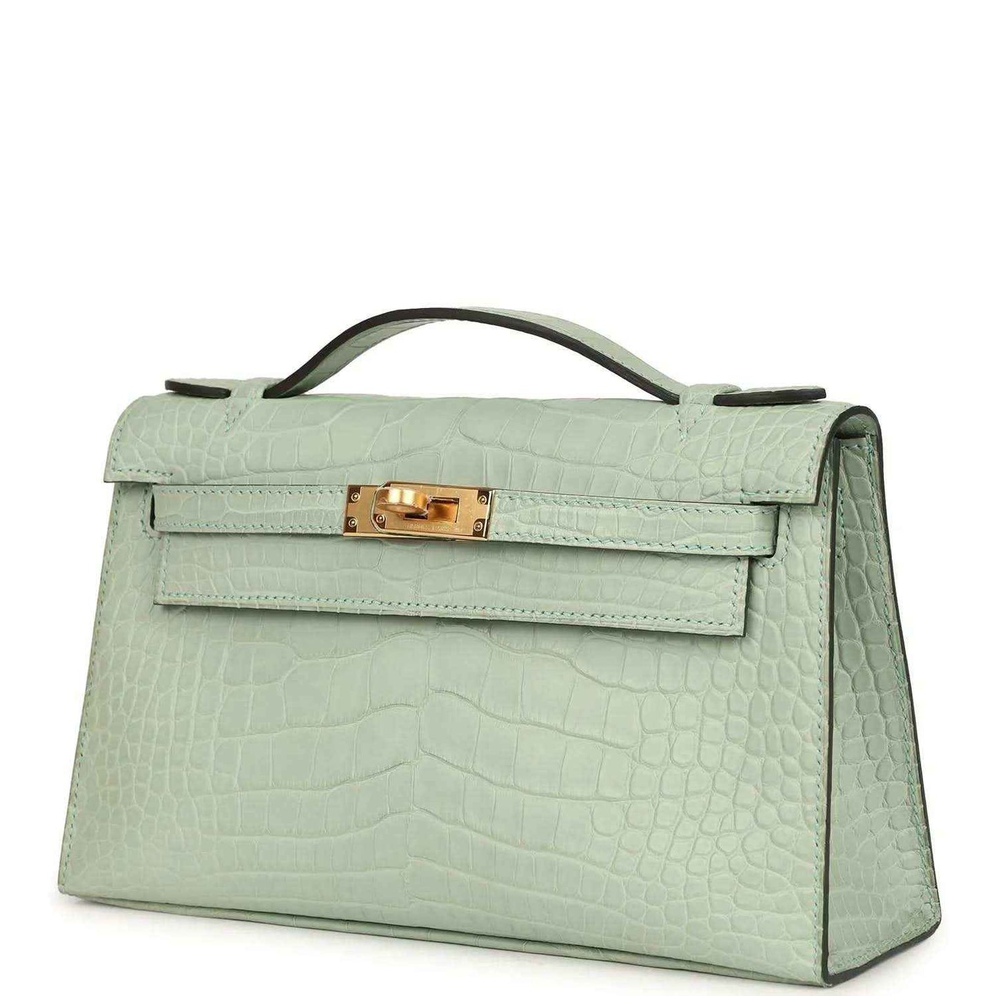 Mint green alligator-style pochette side profile with gold front clasp and handle