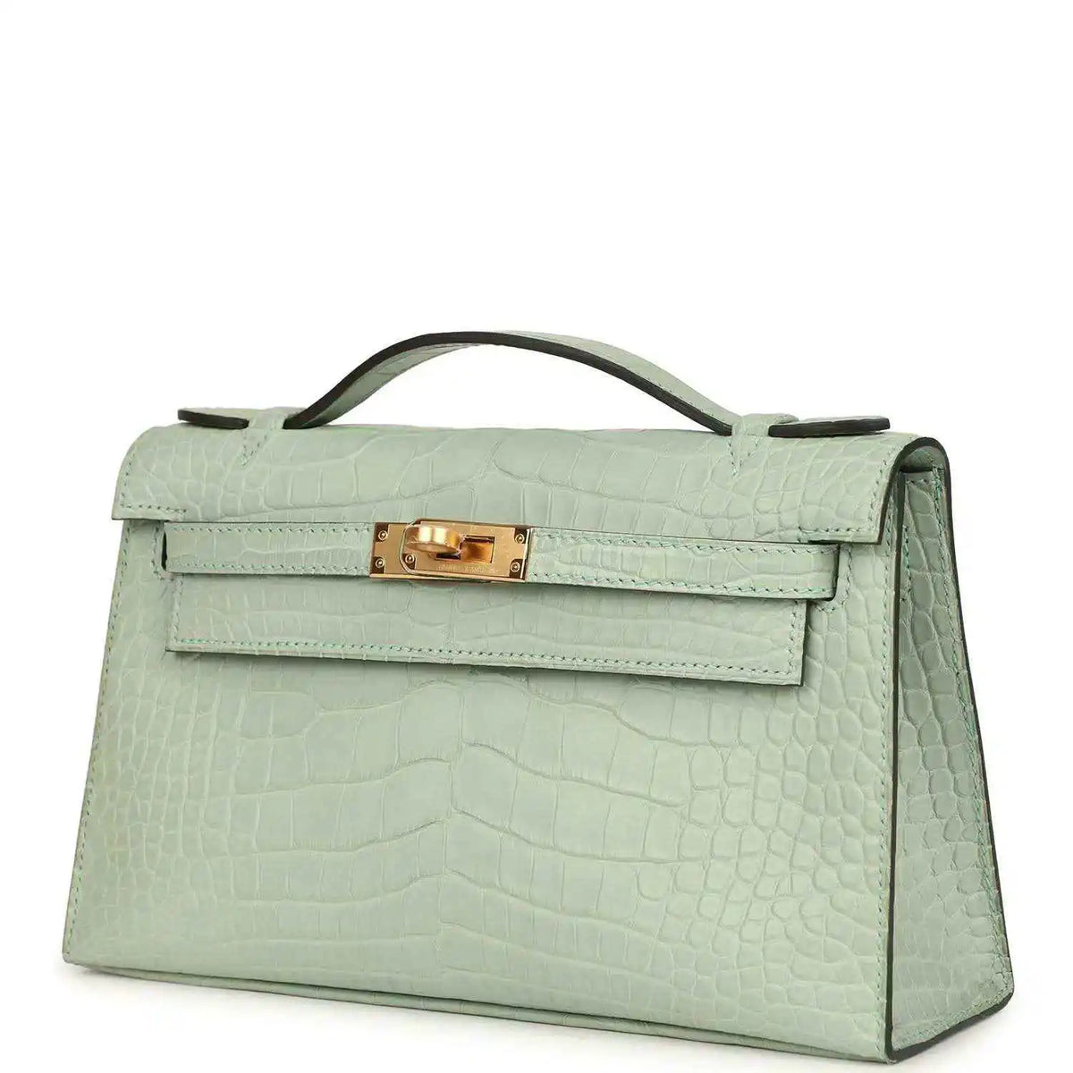 Mint green alligator-style pochette side profile with gold front clasp and handle