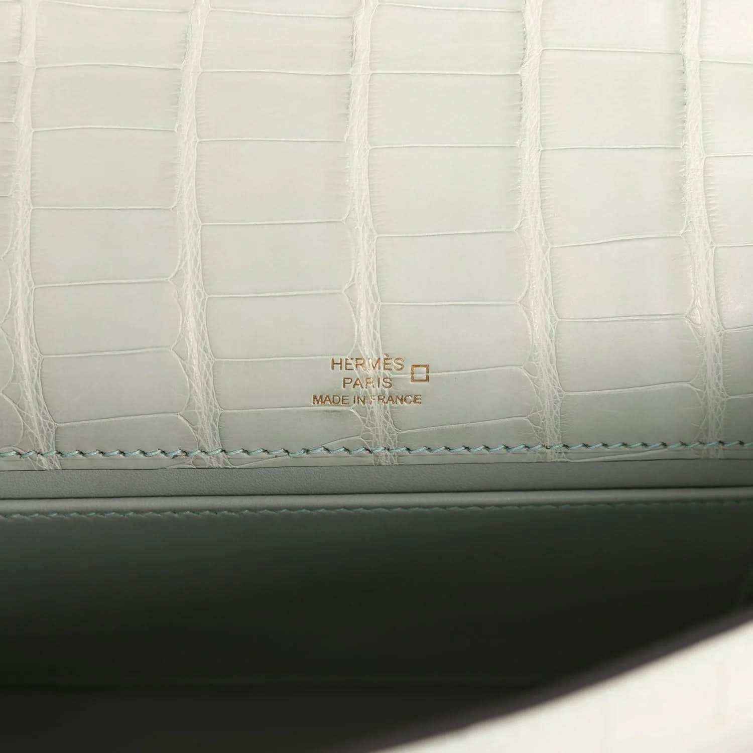 Mint green alligator-style lining with Hermes Paris label and stitched border