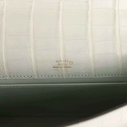 Mint green alligator-style lining with Hermes Paris label and stitched border