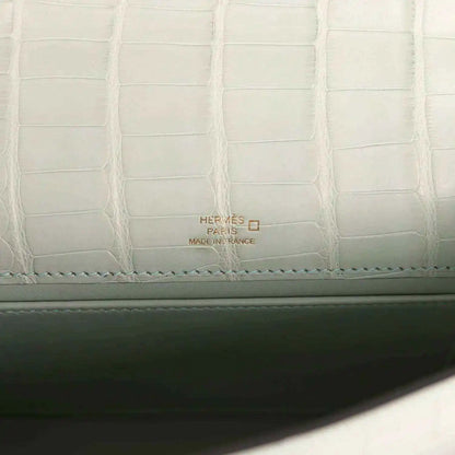 Mint green alligator-style lining with Hermes Paris label and stitched border
