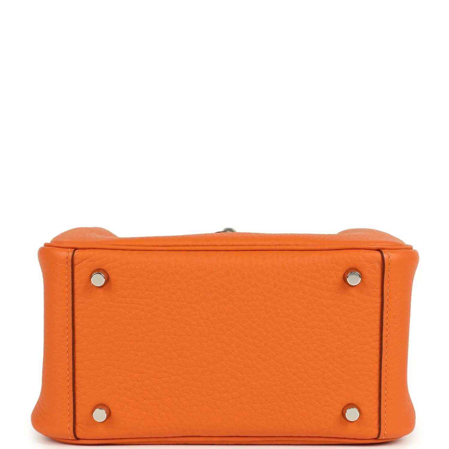 Orange leather mini handbag front view with corner hardware and sturdy reinforced sides.