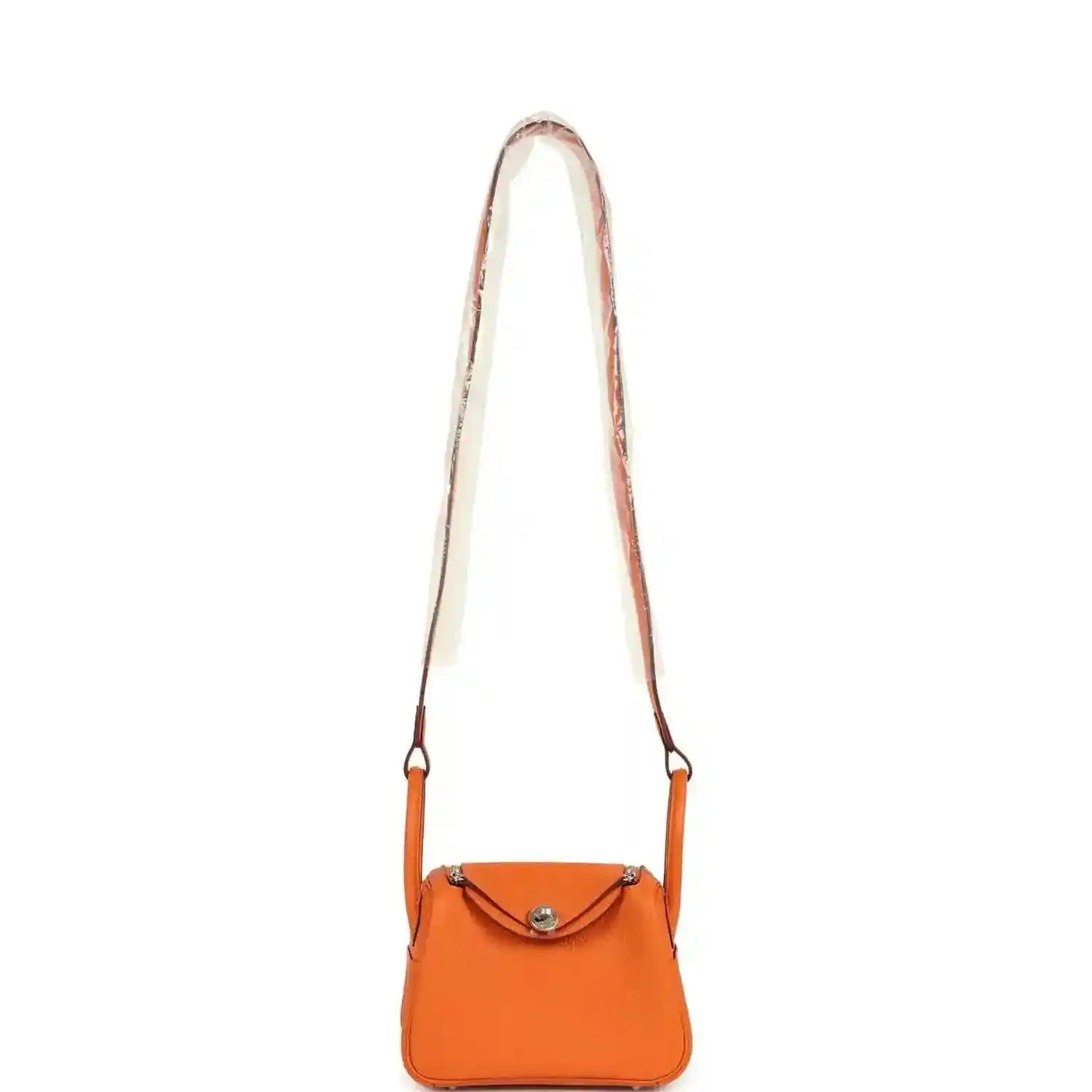 Orange leather mini crossbody bag with long strap and small flap closure.