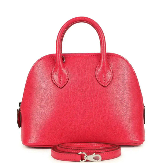 Hermes mini Bolide bag in red leather with top handles and matching crossbody strap