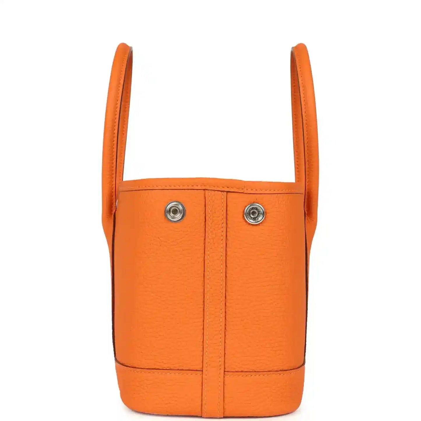 Orange leather mini tote bag with two top handles and vertical seams