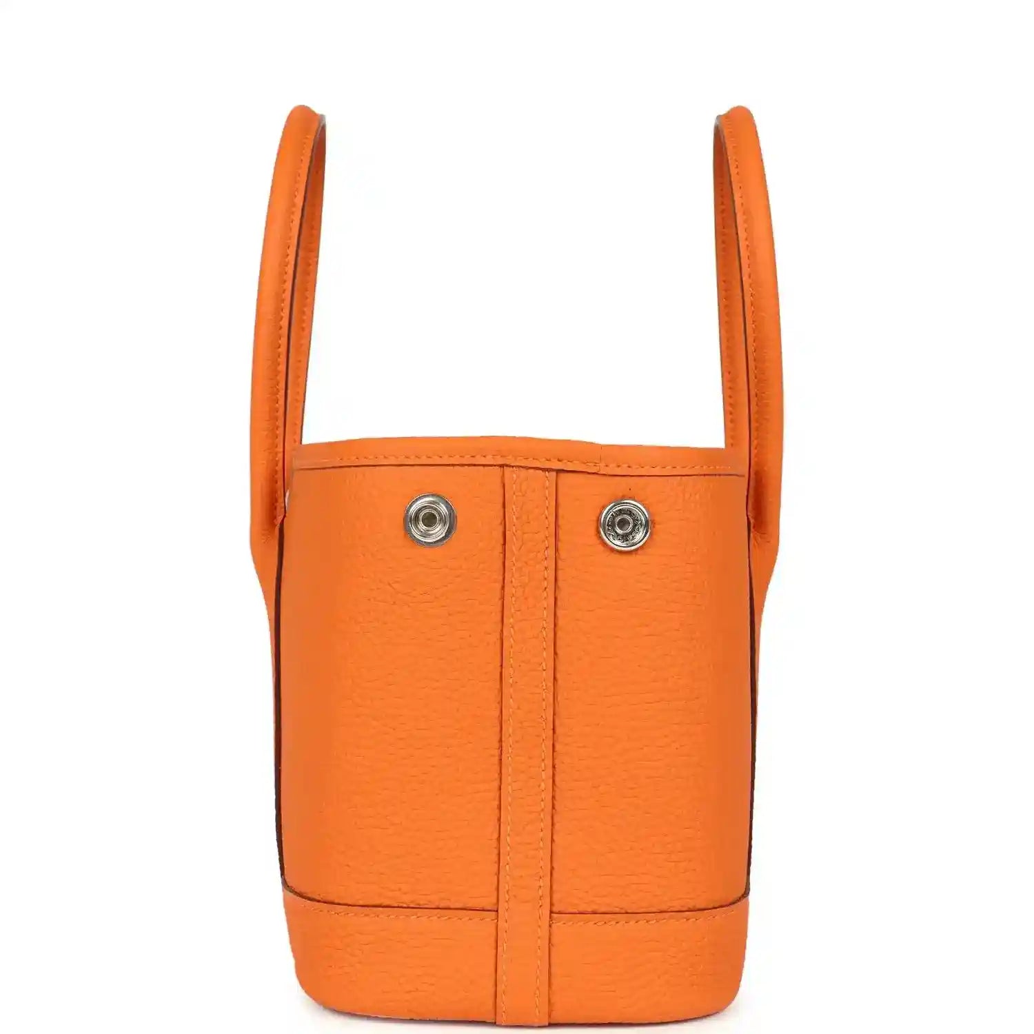 Orange leather mini tote bag with two top handles and vertical seams