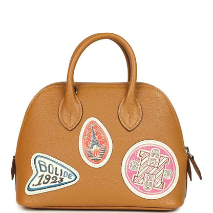 Mini tan leather handbag with two handles and mixed colorful logo patches