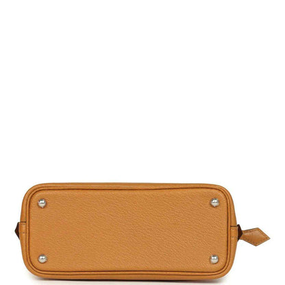 Mini tan leather handbag base with four metal studs and side leather pull tab