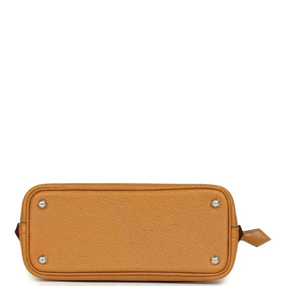 Mini tan leather handbag base with four metal studs and side leather pull tab