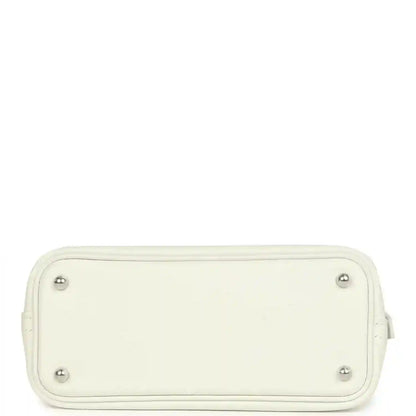 Hermes white mini Bolide bag bottom view with four metal feet and stitched edges