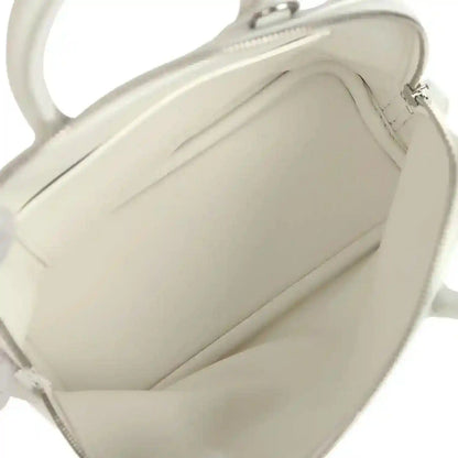 Hermes mini Bolide bag open interior with smooth white lining and zipper close