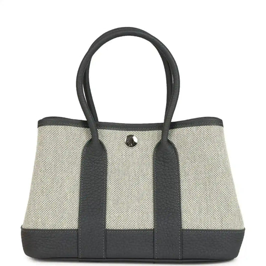 Hermes Garden Party Neo 23 tote in ecru canvas with dark leather trim and handles