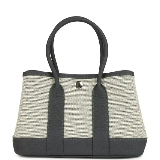 Hermes Garden Party Neo 23 tote in ecru canvas with dark leather trim and handles