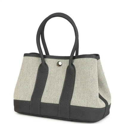 Hermes Garden Party Neo 23 tote, ecru canvas body with dark leather handles and clasp