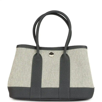 Hermes Garden Party Neo 23 tote with ecru canvas body and dark leather handles