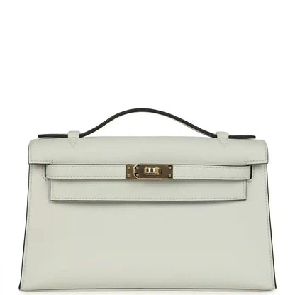 Hermès Kelly pochette in light gray Swift leather, gold-tone front clasp