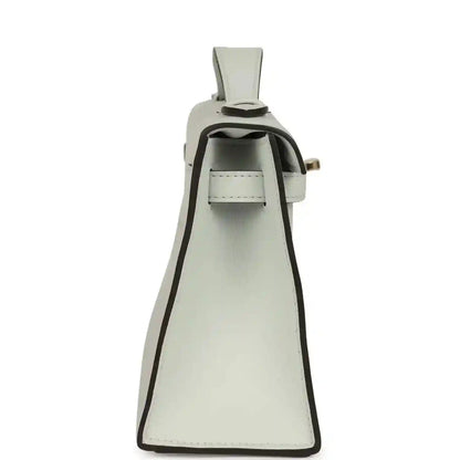 Kelly-style leather pochette in light gray with open flap and interior compartment