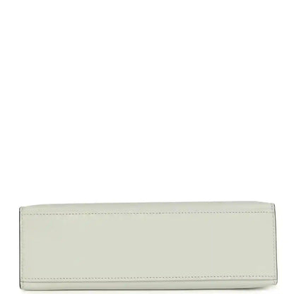 Light gray leather pochette clutch with stitched edges and rectangular base