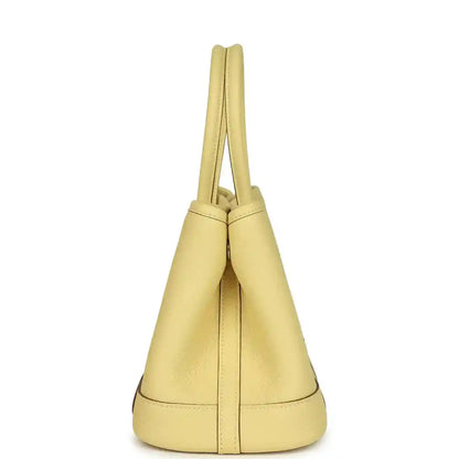 Yellow leather tote bag with top handles, structured sides and stitched base