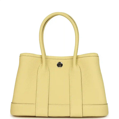 Hermès Garden Party Neo 23 tote bag front view, yellow leather with snap button