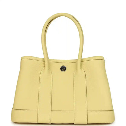 Hermès Garden Party Neo 23 tote bag front view, yellow leather with snap button