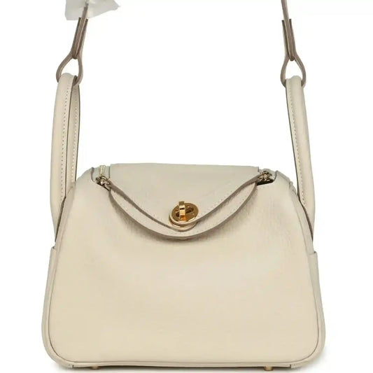 Hermes mini Lindy II bag, pale cream leather, gold clasp, two top handles
