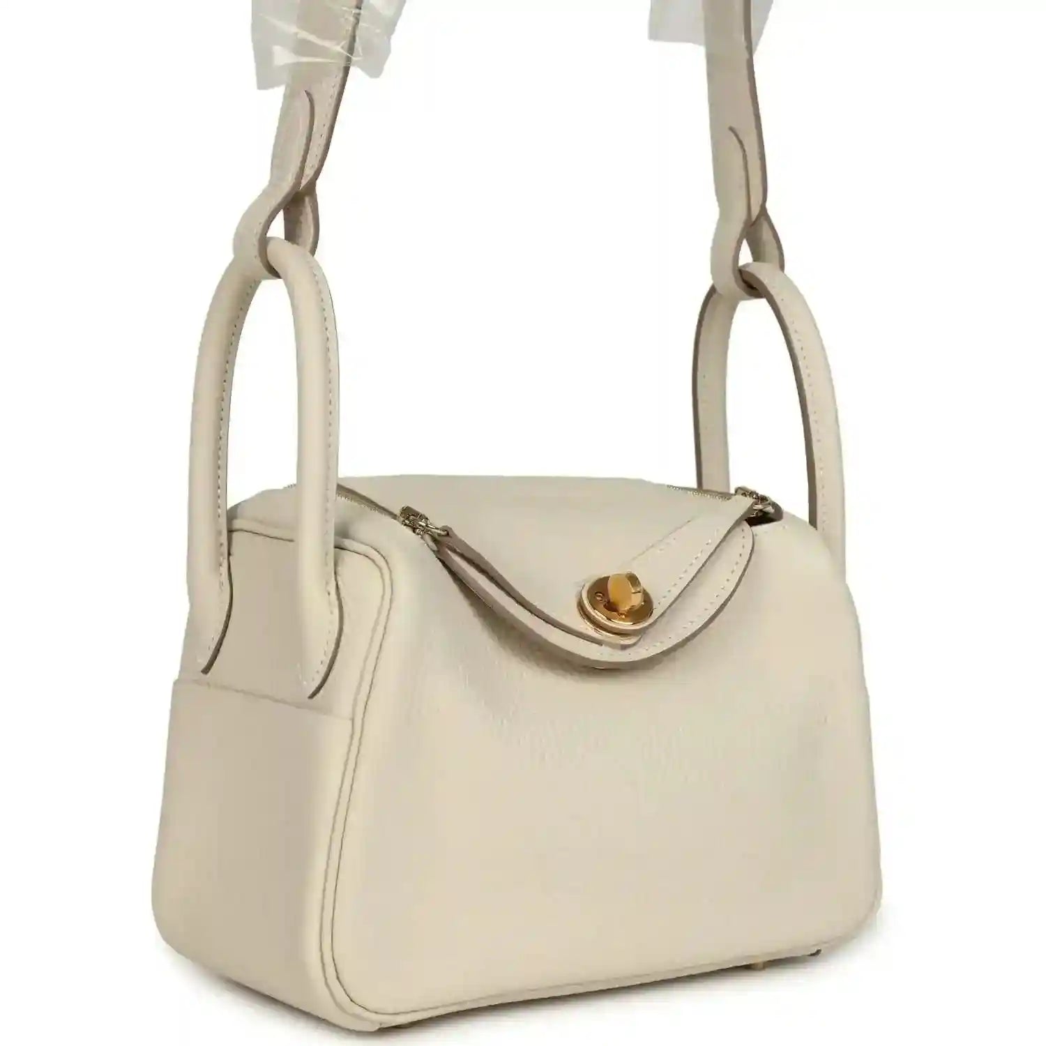 Hermes mini Lindy II bag, pale cream leather, gold turn-lock clasp, side view