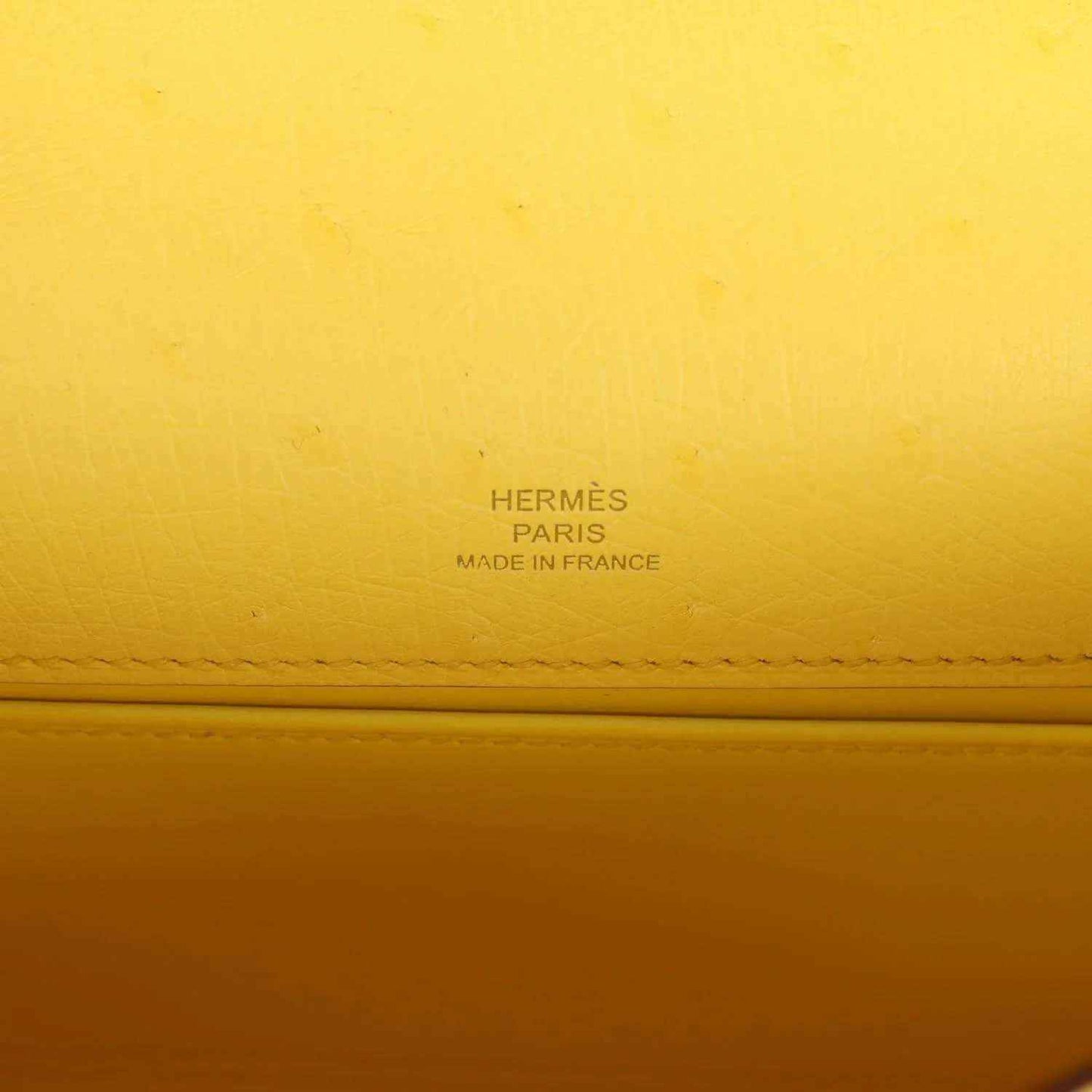 Yellow leather pochette with Hermes Paris and Made in France stamp detail