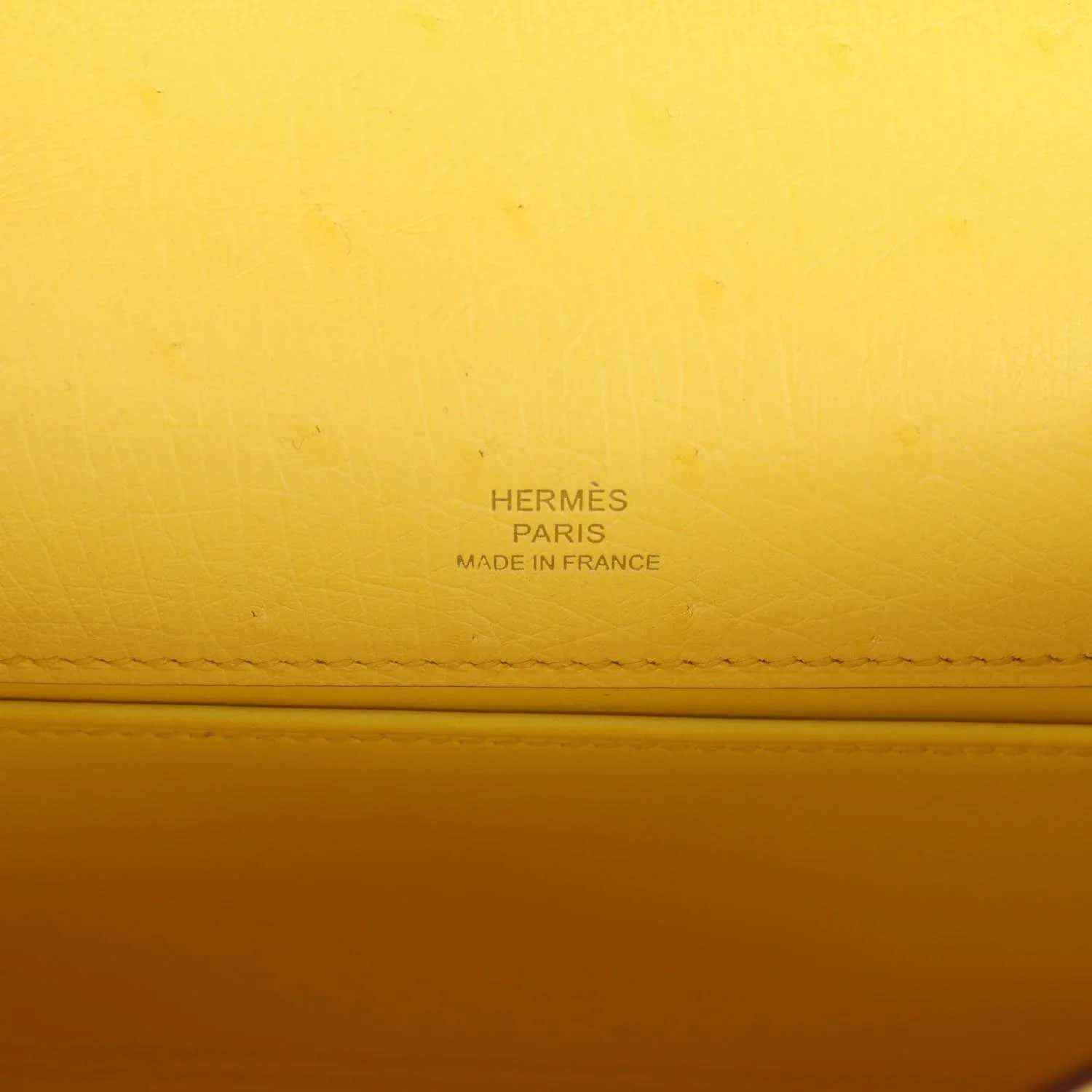 Yellow leather pochette with Hermes Paris and Made in France stamp detail