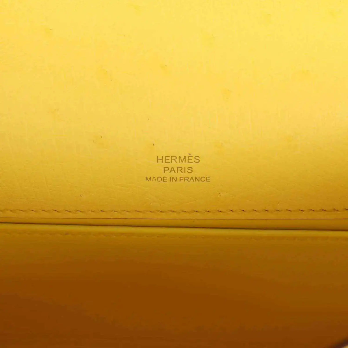 Yellow leather pochette with Hermes Paris and Made in France stamp detail