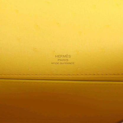 Yellow leather pochette with Hermes Paris and Made in France stamp detail