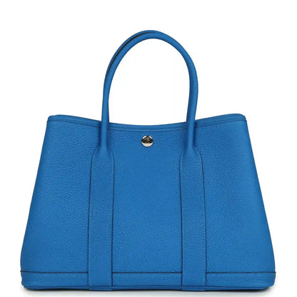 Blue leather Garden Party 30 tote bag with top handles and front snap clasp