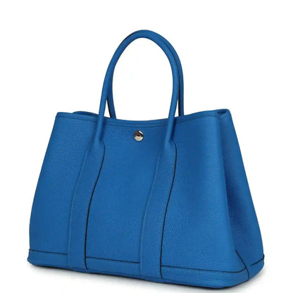 Blue leather Garden Party 30 tote bag with curved top handles and snap closure