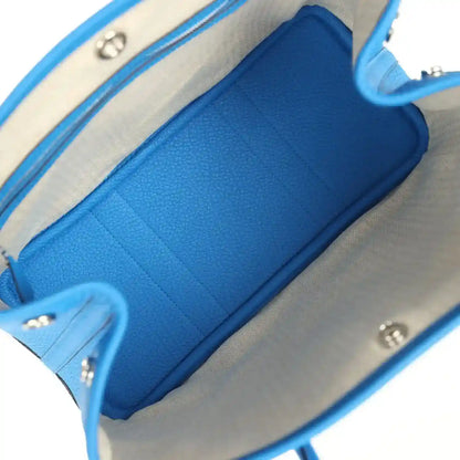 Blue leather Garden Party 30 tote bag interior with zipper pocket and fabric lining