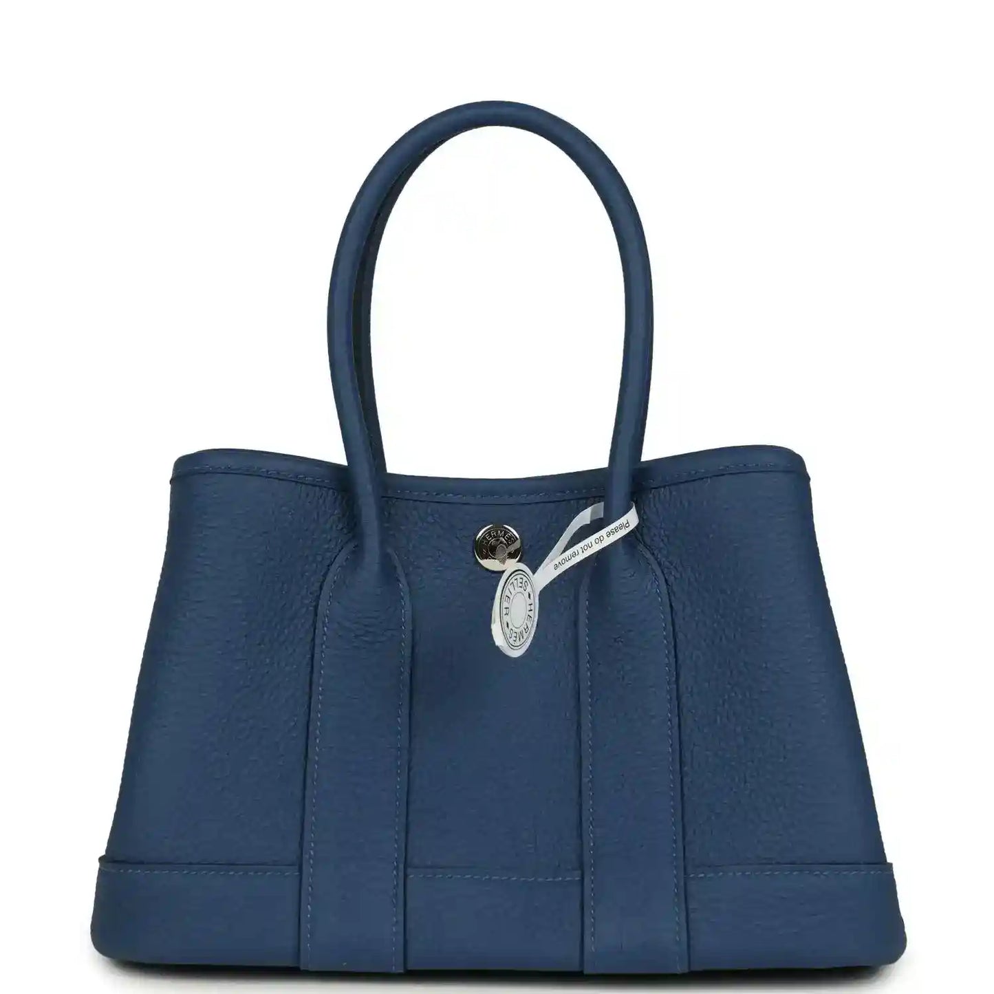 Blue leather tote with front clasp and small hanging leather tag