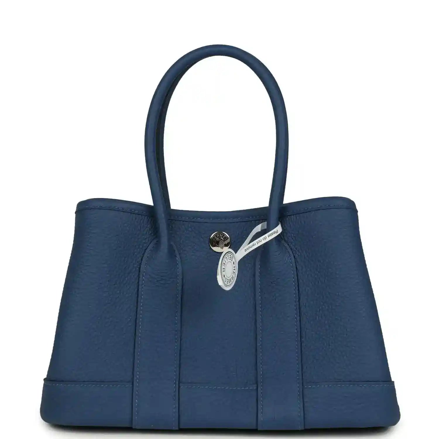 Blue leather tote with front clasp and small hanging leather tag