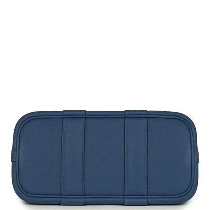 Blue leather front panel with stitched compartments and rounded edges
