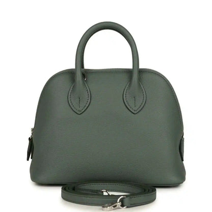 Mini Bolide handbag in dark green textured leather with top handles and silver-tone hardware