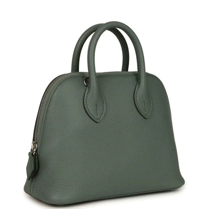 Mini Bolide handbag in dark green textured leather with top handles and side detail