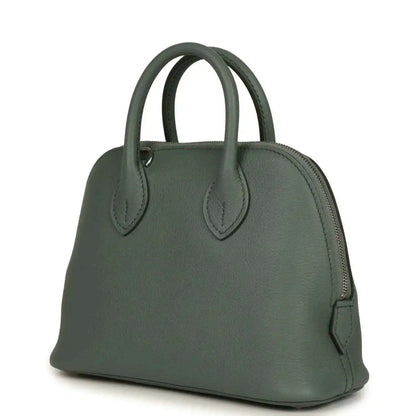 Mini Bolide handbag in dark green textured leather with side strap and top handles